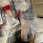 Security-sealed mystery clearance bundle containing branded high-street cosmetics and retail items including The Whit… — image 4