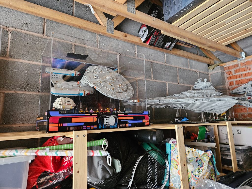 Part of the collection in the garage, including the LEGO Star Wars UCS Imperial Star Destroyer 75252 — Lot 217